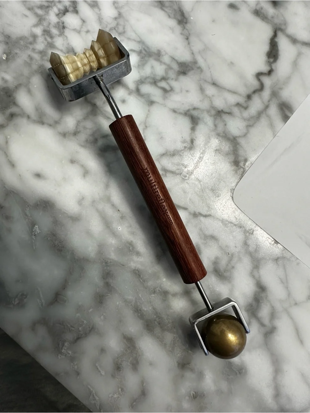 Concave Facial Roller Brown and Brass beauty tool